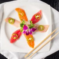 Sashimi Jalapeno · Tuna, salmon, yellowtail with yuzu sauce.