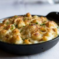 Baked Mac & Cheese · Brie and gruyere cheese topped with crispy bread crumbs