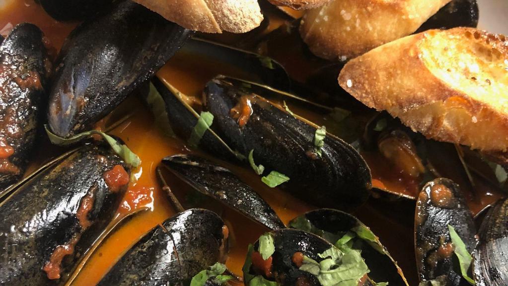 Pei Mussels · Prince Edward Island Mussels, white wine-tomato-basil broth, toasted baguettes