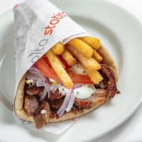 Pork Gyro Pita · Pork Gyro rotisserie slices wrapped in toasted Pita bread with Lettuce ,tomato, onions and T...