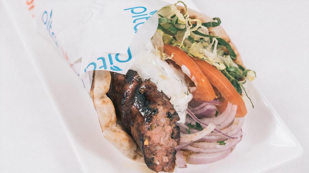 Greek Sausage Pita · Char-broil Greek sausage  wrapped in Toasted Pita bread with Lettuce ,tomato, onions and Tzatziki sauce.