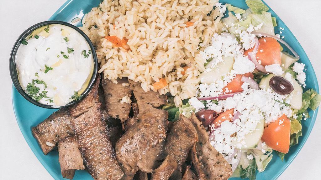 Beef-Lamb Gyro Platter · Rotisserie  Beef and Lamb Gyro Slices Served with Rice or Fries or Lemon Potatoes,Side of Greek Salad, Toasted Pita Bread and Tzatziki Sauce.