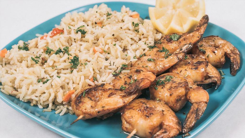 Grilled Shrimp Platter · Grilled Shrimp Served with Rice or Fries or Lemon Potatoes,Side of Greek Salad, Toasted Pita Bread and Lemon Herbs Sauce.