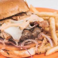 Pita Station Burger · 8oz Charbroiled Burger topped with Bacon Graviera  Cheese, Pita Station Sauce on a Brioche B...