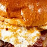 Texas Burger · 8oz Charbroiled Burger topped with Bacon,Fried Egg, Melted  Cheese on a Brioche Bun.Served w...
