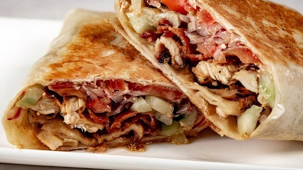 Chicken Blt Wrap · Grilled Chicken, Bacon, Lettuce, Tomato, Red Onions, Tzatziki Sauce.