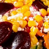 Greens & Beets Salad · Mix Greens, Roasted red Beets, Feta, Walnuts, Corn, Tomato, Honey Dijon Dressing.