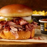 Pulled Pork Sandwich Plate · Our delicious smoked pork on a brioche bun, served with 2 sides.