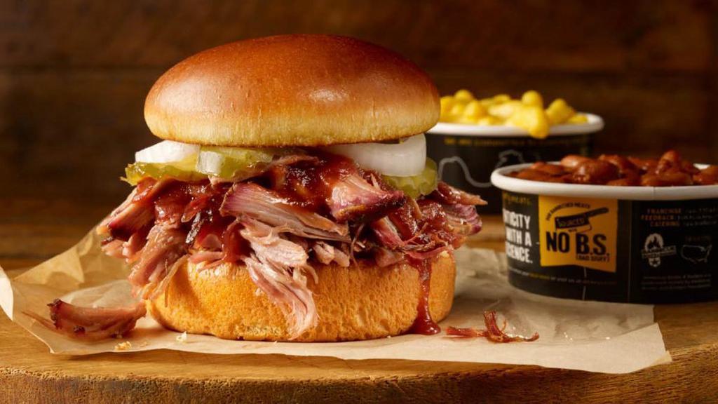 Pulled Pork Sandwich Plate · Our delicious smoked pork on a brioche bun, served with 2 sides.