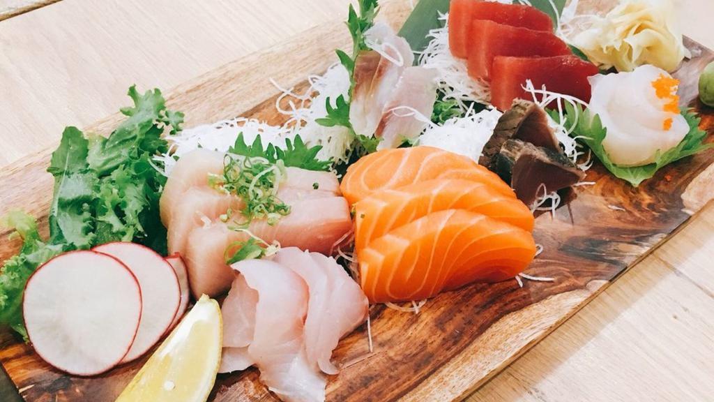 Sashimi Deluxe · Eighteen pieces of assorted raw fish.