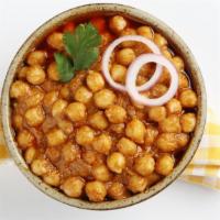 Channa Masala · Aromatic, spicy onion, tomato and masala spiced curry stewed with tender chickpeas. Add one ...