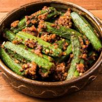Bhindi Masala · Fresh okra cooked in onion, tomato, ginger, garlic with mildly tasteful spices topped with c...