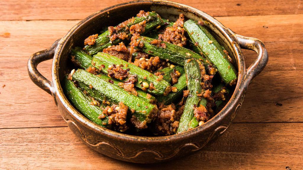 Bhindi Masala · Fresh okra cooked in onion, tomato, ginger, garlic with mildly tasteful spices topped with cilantro.