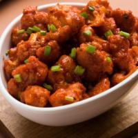 Gobi Manchurian · Traditionally prepared deep-fried and deliciously battered cauliflower cooked in a spicy soy...