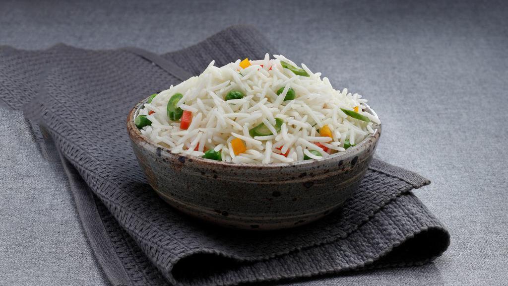 Peas Pulao · Fluffy, aromatic basmati rice with warming spices and sweet green peas.