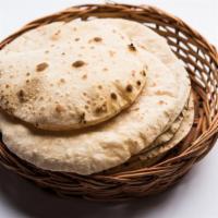 Tawa Roti · Light, whole wheat, griddled flatbread cooked until puffed on a traditional tawa pan.