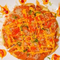 Sushi Pizza · Chopped spicy tuna or spicy salmon avocado masago served on a pancake.