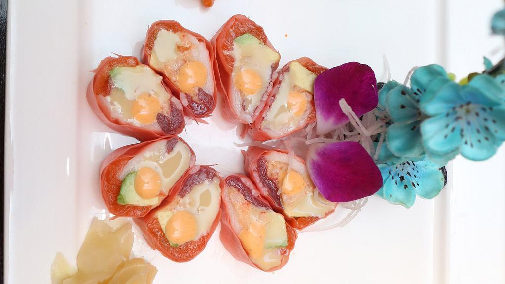 Sakura Roll · Crabmeat, lobster salad and avocado inside wrap with tuna and soybean paper (no rice) trio sauce.