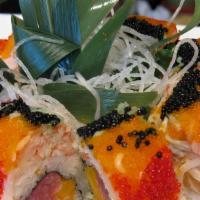 French Kiss Roll · Tuna, salmon and mango inside topped with snow crab and tri-colored fish caviar.