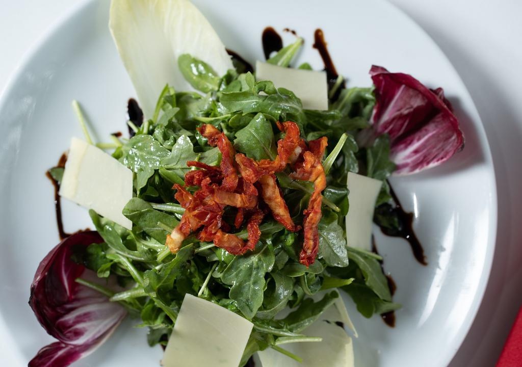 Insalata Di Arugula Individual · Arugula, endive, radicchio, sun-dried tomatoes, honey vinaigrette, shaved parmesan cheese.