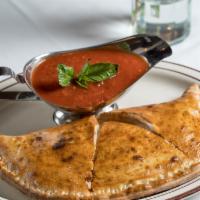 Calzone · Ricotta + mozzarella with side of marinara sauce.