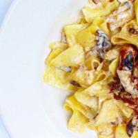 Pappardelle Alla Toscanese Family Serving · Fresh wide ribbon pasta, sun-dried tomatoes, wild mushroom, marsala wine, aged parmigiana, p...