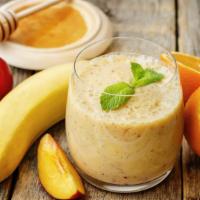Passion Peach · Thick Fruity Smoothie with Peach, Banana, Orange, and Apple Juice.