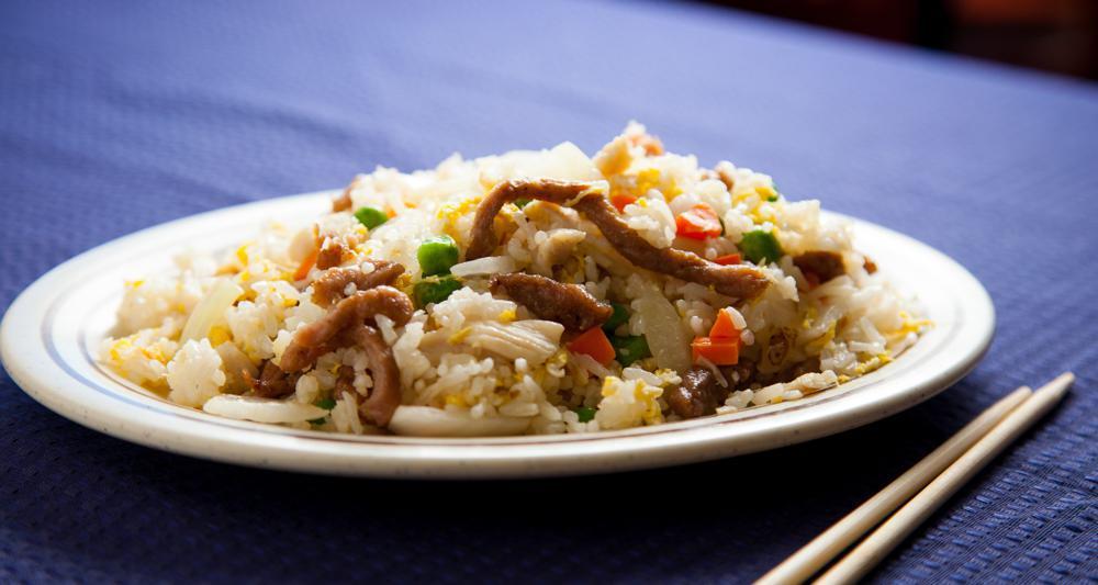 Pint Of Young Chow Fried Rice · Chicken, beef, egg, peas, carrots, and onions with white rice.