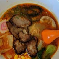 Curry Ramen · Spicy. Curry soup. 3 pieces char siu, fish cake, green vegetable, egg, bamboo, scallion and ...