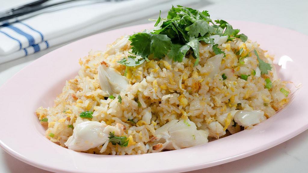 Crab Fried Rice To Go · Crab, rice, egg, scallion, cilantro, cucumber served with nam jjm seafood and prik nam pla.
