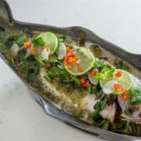 Steamed Fish To Go · Whole fish, chili, lime, mint, culantro in cilantro lime broth. Moderately spicy.