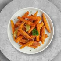 Sweet Spuds · Thick-cut sweet potato wedges fried until golden brown