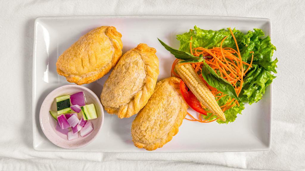 Chicken Curry Puffs (3 Pieces) · Fluffy pastries filled with curry chicken, onions, and potatoes.