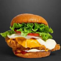 Cheesy Chicken Sandwich · Cheddar, mozzarella, fried chicken breasts, lettuce, tomato, red onion, mayo, ketchup on a w...