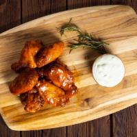 Bomb Bbq Wings · Wings cooked and tossed in classic BBQ Sauce.
