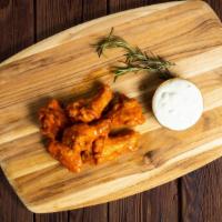 Buffalo Strong Wings · Wings cooked and tossed in our buffalo wing sauce.
