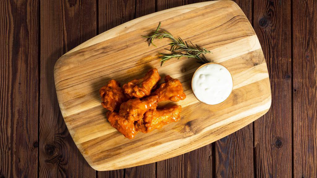 Buffalo Strong Wings · Wings cooked and tossed in our buffalo wing sauce.