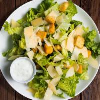 The Caesar Salad · Refreshing green salad with a mix of romaine lettuce, croutons dressed with caesar dressing.
