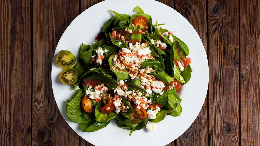 Spinach Me Up Salad · Fresh feta cheese, almonds, tomatoes, raspberry vinaigrette in a bed of baby spinach.