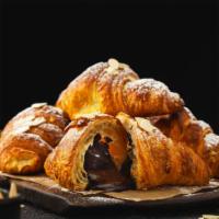 Chocolate Croissant · Flaky buttery and melt in your mouth croissant with chocolate baked inside.