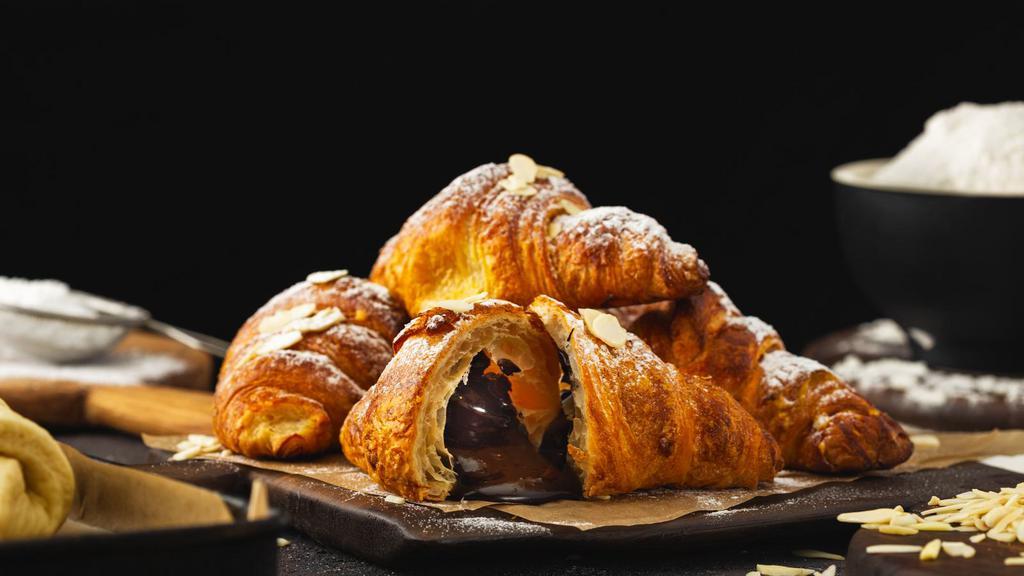 Chocolate Croissant · Flaky buttery and melt in your mouth croissant with chocolate baked inside.