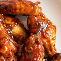 Bbq Wings · Traditional bone-in wings,Hand-tossed in your choice of
sauce or rub. Choose your
flavors!