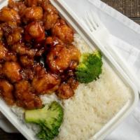 General Tao Chicken · Deep fried chicken covered in sweet spicy sauce with broccoli.
