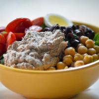 Niçoise · Tuna salad, Kalamata olives, egg, tomato and chickpeas. Made with a crispy blend of romaine ...