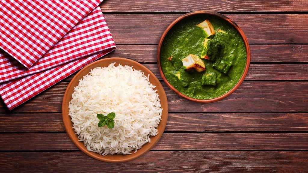 Spinach Cottage Cheese Rice Bowl  · A flavourful yet spicy spinach curry with fresh chunks of cottage cheese, served with aromatic white rice.