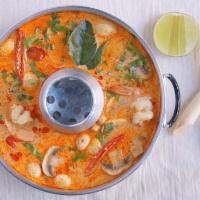 Chicken Tom Yum Soup · The iconic sour and spicy creamy tom yum soup cooked with mushrooms and a variety of fragran...