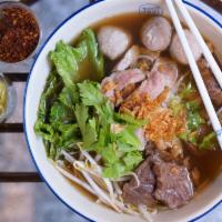 Stewed Beef Noodle Soup · House recipe herb-based soup, served with rice noodles, stewed beef, homemade beef balls, be...