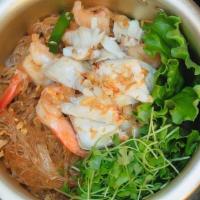 Woonsen Koong Pu · Pan fried bean noodles with shrimp, crab meat, ginger, celery, garlic and pepper in a pot se...