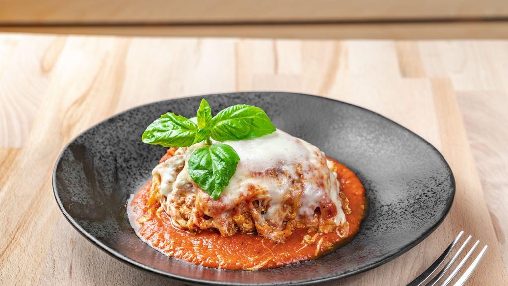 Lasagna · Layers of pasta, ricotta cheese, mozzarella cheese, ground beef, bechamel sauce, tomato sauce, topped with sliced mozzarella and baked in the oven (does NOT contain pork)