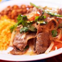 Bistec A La Mexicana · Grilled chopped tender steak accompanied with onions, tomatoes, serrano peppers, and fresh c...
